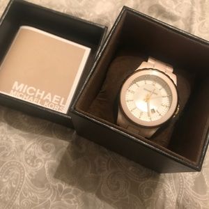 Michael Kors white ceramic watch.
